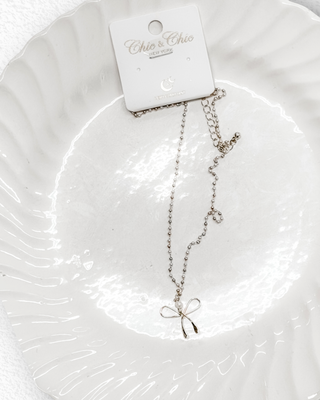 with a bow necklace